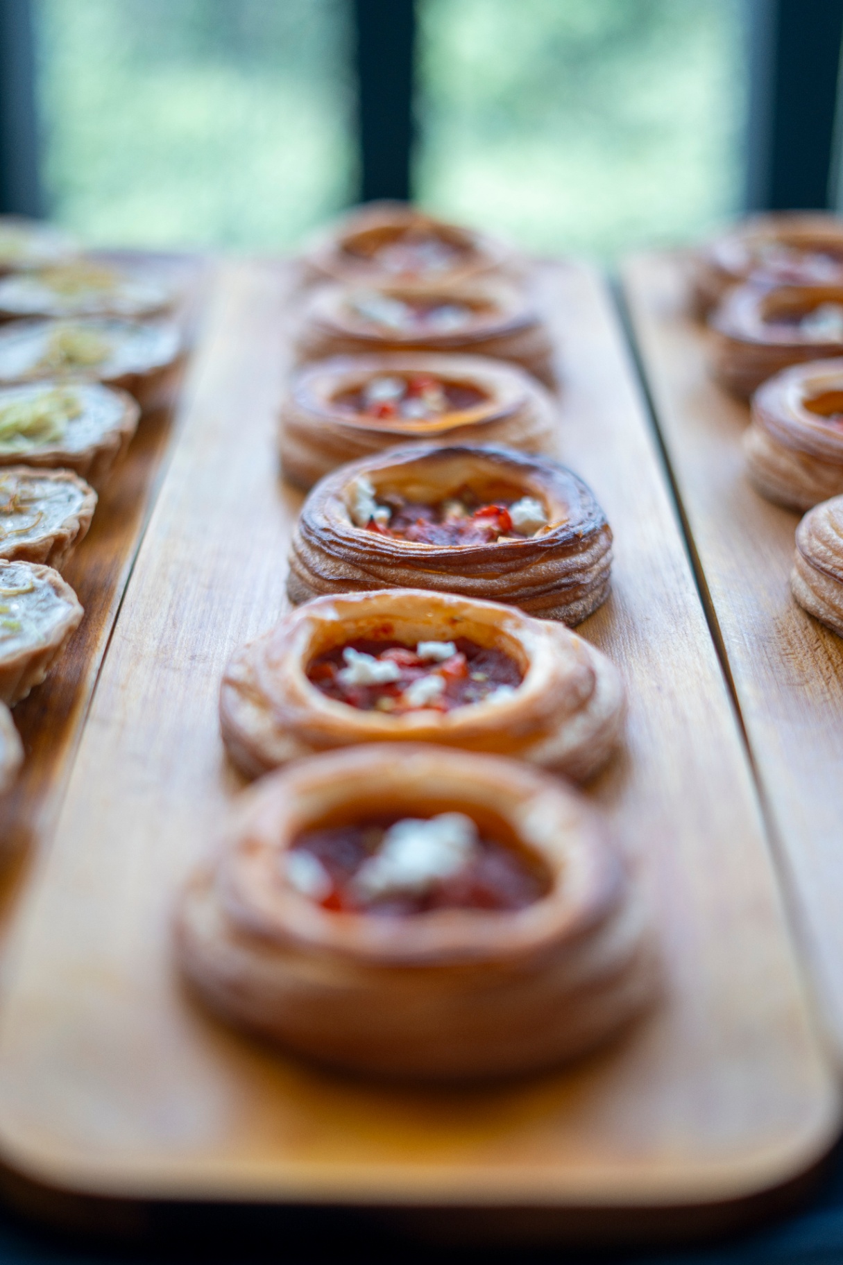 Savoury pastries on a wooden board